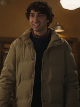 Spencer Gilpin Jumanji Open World beige puffer jacket three quarter view restaurant