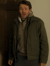 Jason Dessen Dark Matter olive green jacket front view indoor scene