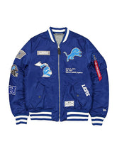 Detroit Lions inspired blue MA-1 bomber jacket with embroidered patches front view