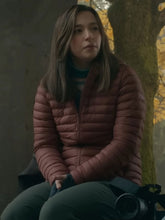 The Social Reckoning Frances Haugen maroon puffer jacket close up front view
