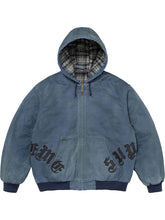 Blue washed cotton hooded jacket shown from the front, featuring plaid lining, zip closure, leather appliqué details and ribbed trim.