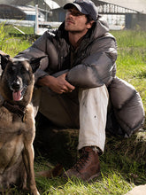 Jacob Elordi Hig The Dog Stars gray puffer coat front view with dog