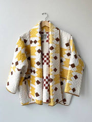 Brenda Film The Parenting 2025 Parker Posey Yellow White Quilted Coat