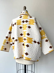 Brenda Film The Parenting 2025 Parker Posey Yellow White Quilted Coat
