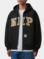 Black zip hoodie worn with WIP chest patch, model front view hands in pockets
