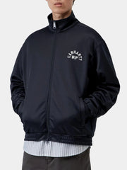 Navy zip-up fleece jacket styled with jeans, model front pose
