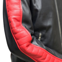 Black leather jacket with red quilted sleeve detail and visible zipper.