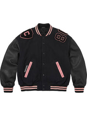 Black Supreme Captain varsity jacket with pink striped ribbing and leather-style sleeves front view
