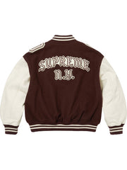 Brown Supreme Captain varsity jacket back view with cream SUPREME N.Y. lettering