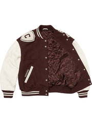 Brown Supreme Captain varsity jacket with cream sleeves and quilted interior lining