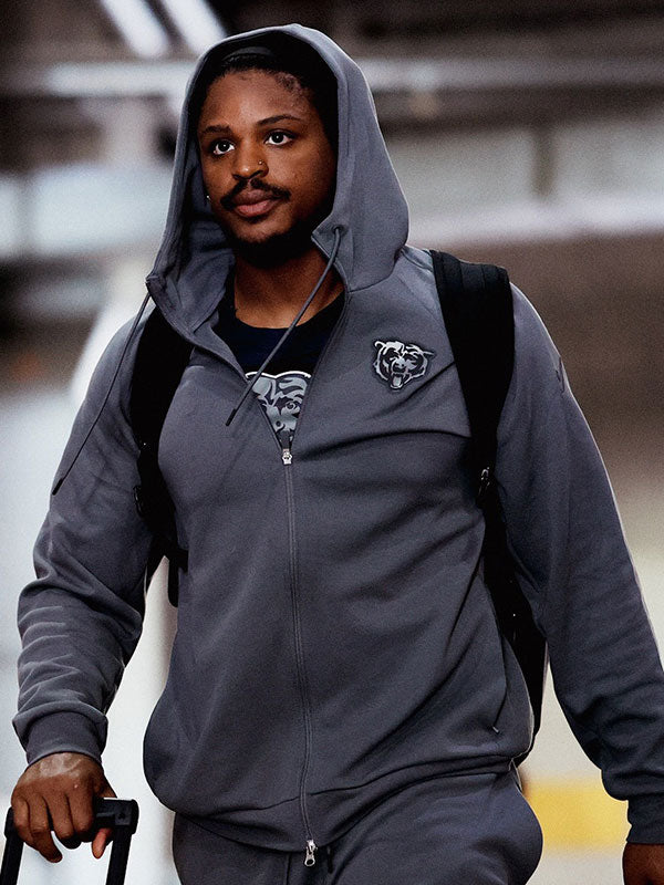 Chicago Bears grey zip hoodie front view walking with luggage