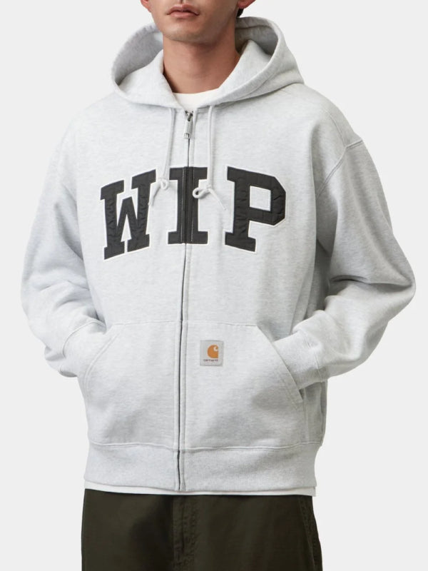 Front view, flat lay, grey hoodie with teal-outlined WIP patch and zip closure