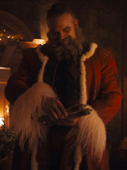 David Harbour Santa Claus red coat front view holding object