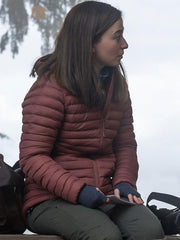 Frances Haugen The Social Reckoning maroon puffer jacket side view snowy scene