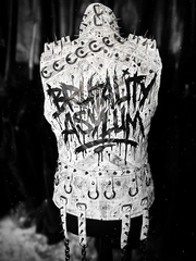 Brutality Asylum White spiked leather vest back detail with punk-style hardware, dark background