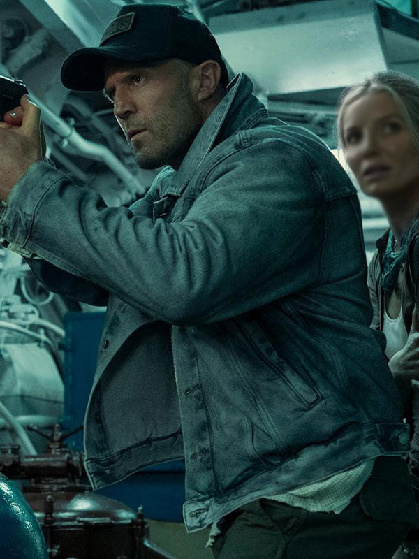 Jason Statham Cole Reed denim jacket front view ship interior