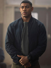 Aaron Pierre Lanterns navy bomber jacket front view indoor scene