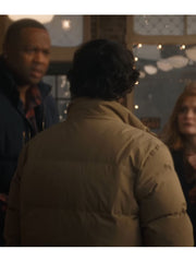 Spencer Gilpin Jumanji Open World beige puffer jacket back view indoor scene