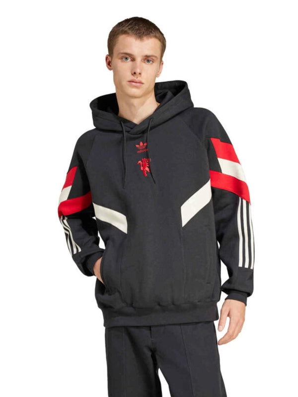 Man Utd black fleece hoodie on model front view with sleeve stripes