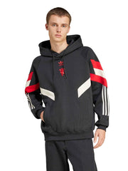 Man Utd black fleece hoodie on model front view with sleeve stripes