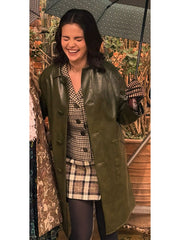 Mabel Mora Only Murders olive green leather coat close up front view laughing