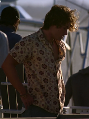 Chase Stokes John B floral shirt front view boat deck