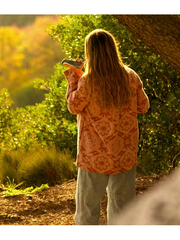 Madelyn Cline Sarah Cameron pink coat back view sunset scene