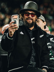 Jason Momoa inspired black wool bomber jacket close up front view stadium