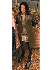 Mabel Mora Only Murders olive green leather coat front view full body outdoor