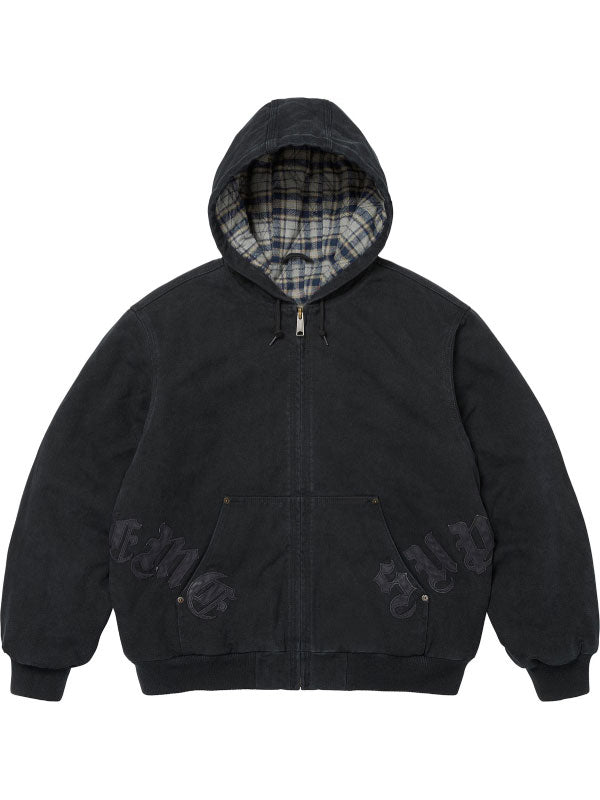 Black washed cotton hooded jacket with plaid-lined hood, dark leather appliqué lettering, front pocket and ribbed cuffs.
