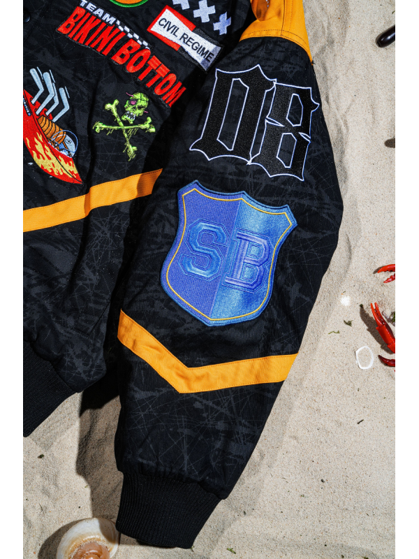 SpongeBob racing jacket SB shield patch close up detail