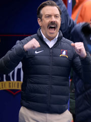 Jason Sudeikis Ted Lasso navy puffer jacket close up sideline celebration
