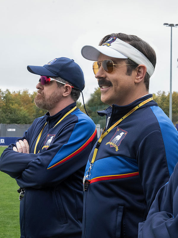 Ted Lasso Jason Sudeikis AFC Richmond tracksuit set side view sideline Season 4