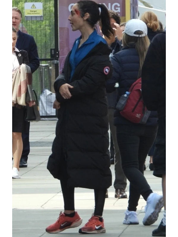 Maia Marten The Runner black puffer coat side view outdoor plaza