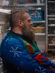 David Harbour Santa Claus sweater side profile snowflake sleeve detail