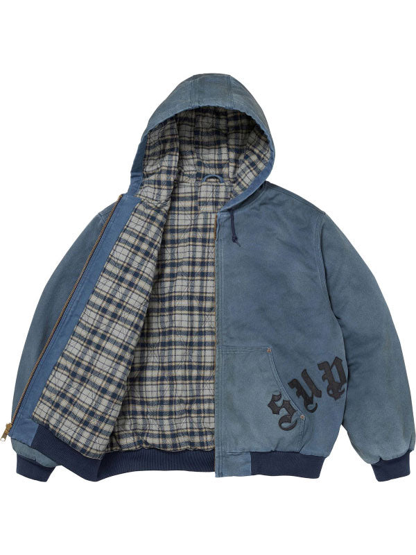 Blue washed cotton hooded jacket opened to show the plaid polyester lining, zip closure, hood and front pocket.